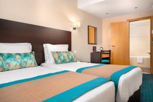 - une chambre d'hôtel avec 2 lits dans l'établissement Hotel DAH - Dom Afonso Henriques, à Lisbonne