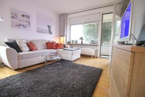 TV a/nebo společenská místnost v ubytování Apartmentvermittlung Mehr als Meer - Objekt 11