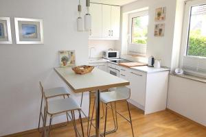 Kuchyň nebo kuchyňský kout v ubytování Apartmentvermittlung Mehr als Meer - Objekt 11