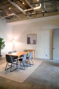 a dining room with a table and chairs at Premium Spacious Apartments at Paperbox Lofts in Salt Lake City in Salt Lake City