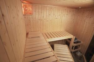 a small wooden sauna with a ladder in it at Apartments ALPsmart in Oetz