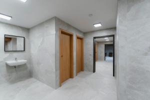 a bathroom with a sink and a mirror at Mlýn Herlíkovice in Hořejší Vrchlabí +89 photos