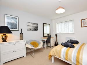 a bedroom with a bed and a desk at 3 bed in Ferryside 51632 in Ferryside