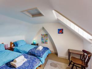 two beds in a room with a staircase at 3 Bed in Whitstable WCC12 in Whitstable
