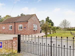 a brick house with a wrought iron fence at 2 Bed in Mattishall 57133 in Mattishall