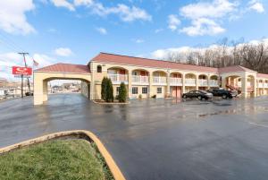 a building with a parking lot in front of it at Econo Lodge Huntington - Barboursville University Area in Huntington