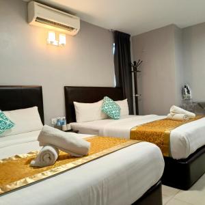 Ένα ή περισσότερα κρεβάτια σε δωμάτιο στο Royale City Hotel - 10 min from KLIA KLIA 2 Airport