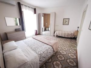 Postelja oz. postelje v sobi nastanitve Una Scala Dal Centro