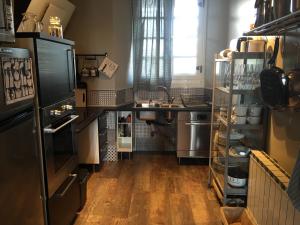 a kitchen with a sink and a counter at Apartamentos cercanos playa 1 in Puentedeume