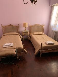Una cama o camas en una habitación de CASA RAWSON TEMPORADA