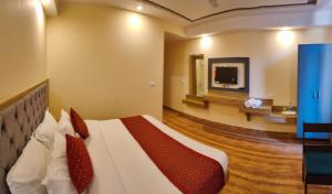 Ένα ή περισσότερα κρεβάτια σε δωμάτιο στο The Fragrance Hotel +50 φωτογραφίες