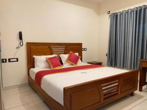 Postel nebo postele na pokoji v ubytování Grand Residency & Resort