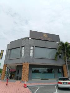 a building with a car parked in front of it at Royale City Hotel - 10 min from KLIA KLIA 2 Airport in Sepang