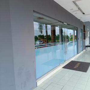 a large swimming pool inside of a building at Royale City Hotel - 10 min from KLIA KLIA 2 Airport in Sepang