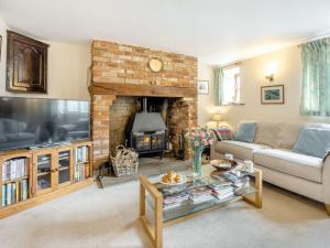 a living room with a couch and a fireplace at 3 bed in Carisbrooke IC037 in Newport