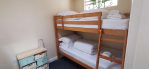 a bunk bed room with two bunk beds at The Wee Hoose in Dumfries