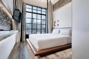 Postel nebo postele na pokoji v ubytování Z Hotel Shanghai Bund Shamei Building