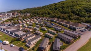 an aerial view of a town with houses and a parking lot at The Royal Clovelly caravan with sea views in Bideford