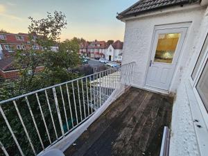 a balcony with a white door on a building at Large 4 bedrooms golders green in London