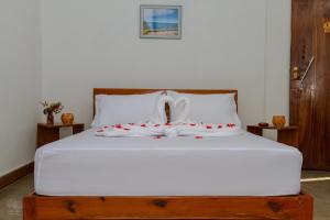 מיטה או מיטות בחדר ב-Canto das Amêijoas