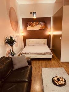 a living room with a bed and a couch at Venice Loft with balcony downtown in Kraków