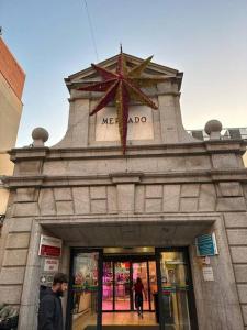 a building with a star on top of it at Market Martinez De La Riva I in Madrid