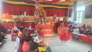 a group of people in a temple with a woman in a room at Unique point home stay in Nagarkot