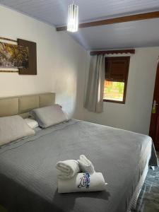 En eller flere senge i et værelse på Pousada Vila Velha