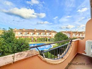 a balcony with a view of a building and a swimming pool at Mar Blau Estartit Rental in L'Estartit
