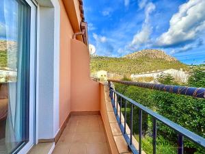 a balcony with a view of a mountain at Mar Blau Estartit Rental in L'Estartit