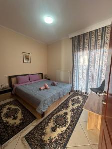 Postel nebo postele na pokoji v ubytování Bakopoulos resort Ένα Όμορφο Διαμέρισμα στα Τρίκαλα