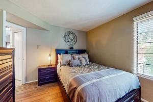 a bedroom with a bed and a window at Village at West Meadow 2441 in Phoenix