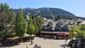 an aerial view of a town with a mountain at Hearthstone Lodge 3 - Central Village Condo with Private Sauna & Hot Tub - Whistler Platinum in Whistler