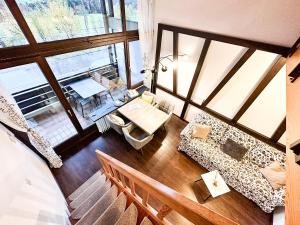 an overhead view of a living room with a couch and a table at Bergzauber in Oberstaufen +7 photos