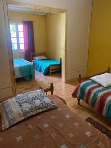 Ένα ή περισσότερα κρεβάτια σε δωμάτιο στο Hospedaje Vista al Mar 39