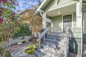 a house with a staircase leading to the front door at Prime Location walk to attractions w Free Parking in Seattle