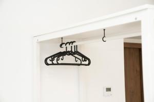 a metal hanging light hanging from a door at Central Station Apartment No5 in Kaunas