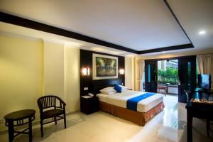 Postel nebo postele na pokoji v ubytování Champlung Mas Hotel Legian