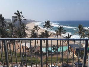 a view of the beach and the ocean from a balcony at Seabrook holiday apartments in Margate