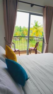 מיטה או מיטות בחדר ב-Coco Nest Colombo Sri Lanka