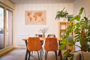 a dining room with a table and two chairs at Lumineux - Elixir - Parking privé in Strasbourg +10 photos