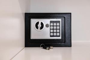 a safe with a keychain attached to a wall at Grgic Apartments - Lux APT2 in Zagreb