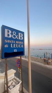 a sign for a santa marina at the beach at B&B Santa Maria Di Leuca in Leuca