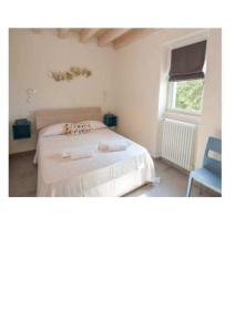 Postel nebo postele na pokoji v ubytování Casa Desil - Appartamento bilocale con terrazza privata + 16 fotografií