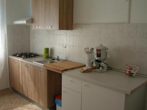 a kitchen with a sink and a counter top at Appartamenti Condominio Daniele in Grado