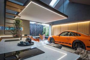 an orange car is parked in a living room at Luxury Guest House in Woodstock