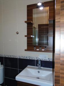 a bathroom with a sink and a mirror at City House in Istanbul