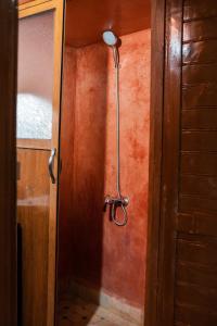 a shower in the corner of a room at Riaad Hamad in Fez