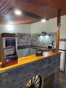 a kitchen with a wooden counter top in a room at Mahatma x habitación in Tacuarembó