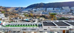 a view of a city with a mountain at Apartamento Robi en Cumana II - Puerto Rico - Ap 508 in Puerto Rico de Gran Canaria